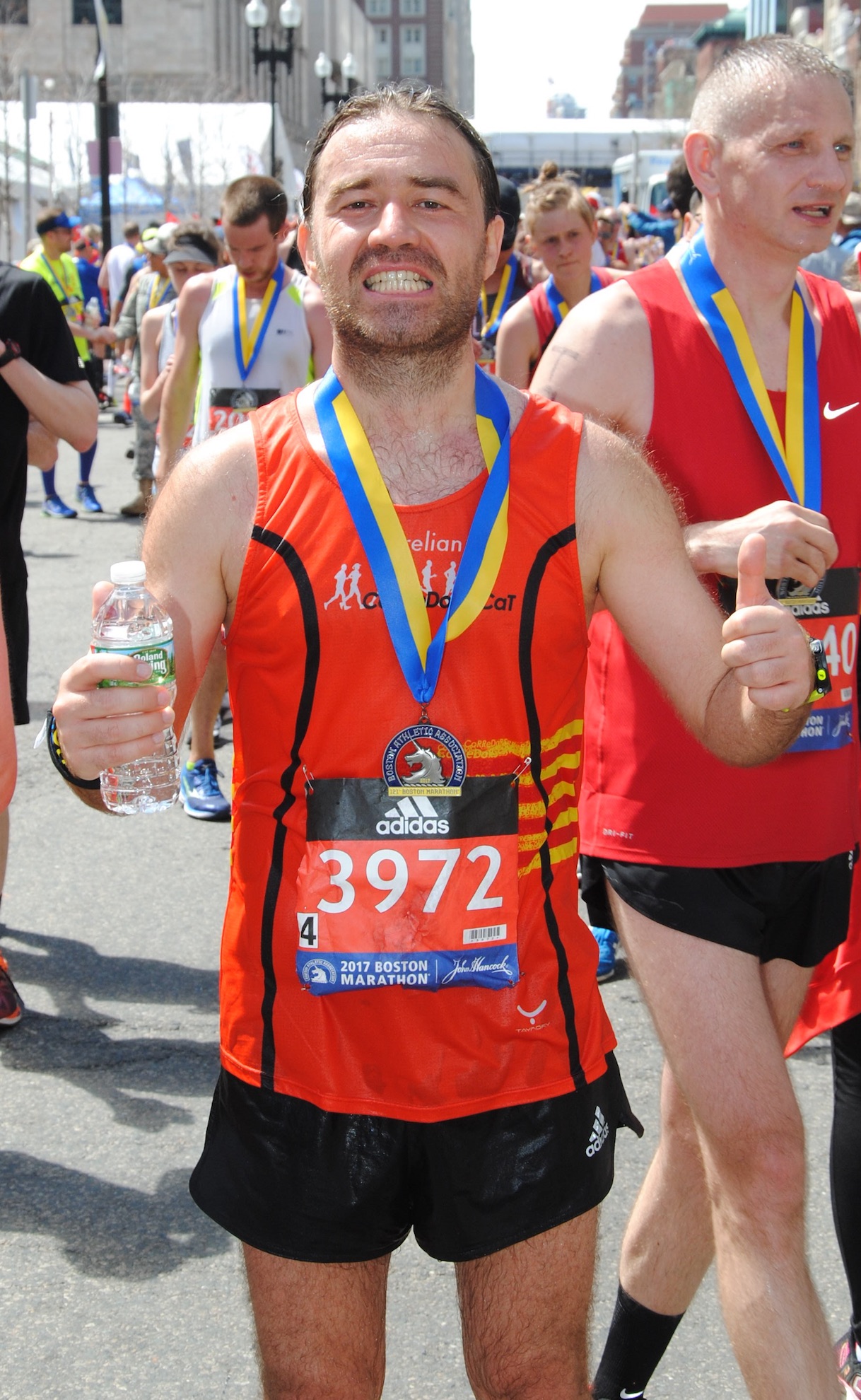 Happy to get the medal<br/>at Boston Marathon finish line 2017